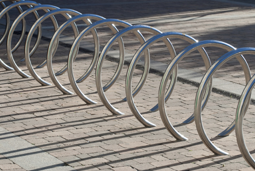 Metal rings sticking out of the ground.